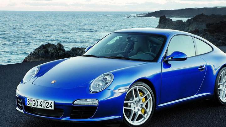 Porsche 911 Carrera S In Blue Near Sea Side